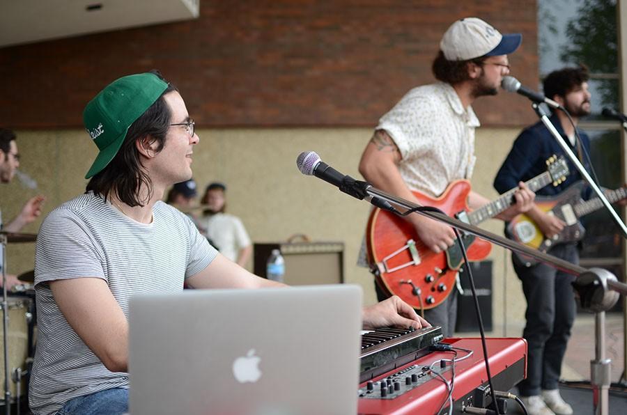 Brad Goodall, Bradley Jenkins and Zack Owens of Ona perform on the Memorial Student Center plaza Thursday afternoon.