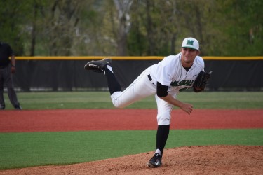 Marshall University freshman Wade Martin throws a pitch against Eastern Kentucky University April 19 at the Kennedy Center Field on Route 2.