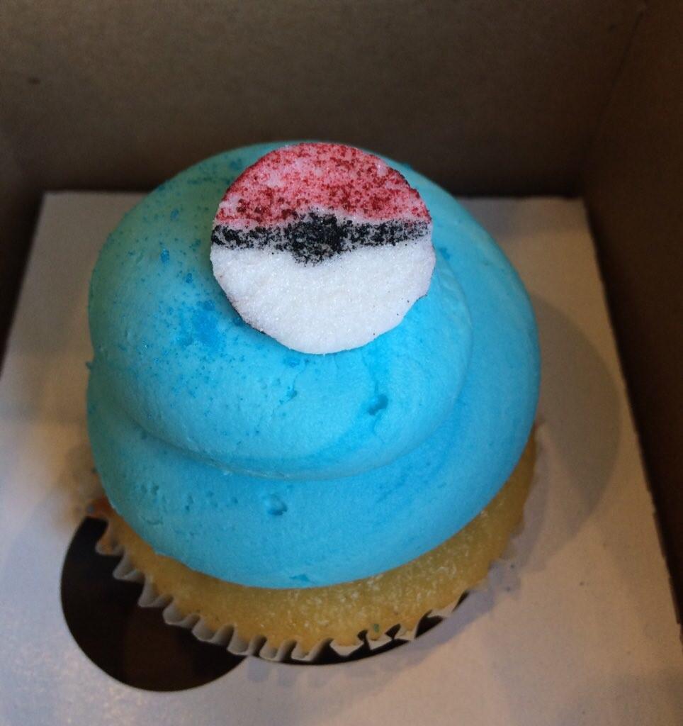 A blue "Team Mystic" cupcake is displayed in Paula Vega Cakes Wednesday. 