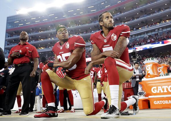 San Francisco 49ers safety Eric Reid (35) and quarterback Colin Kaepernick (7) kneel during the national anthem before an NFL football game against the Los Angeles Rams in Santa Clara, Calif., Monday, Sept. 12, 2016. (AP Photo/Marcio Jose Sanchez)