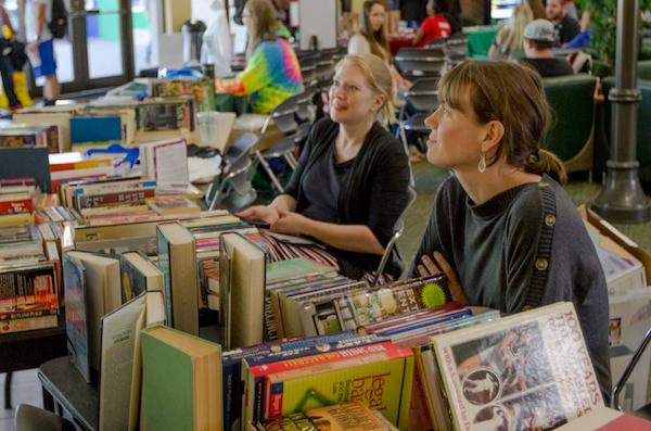 Assistant professor of English Hillary Brewster, a member of the Womens Studies Advisory Board, and Sabrina Thomas, the womens studies library liason, vend books at the Womens Studies Book Sale in the Memorial Student Center, October 4, 2016.