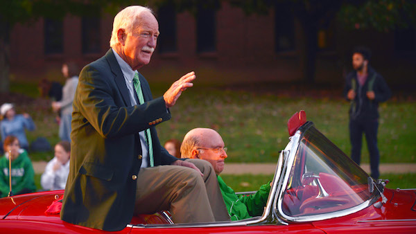 Red Dawson waves as he is cheered in this years homecoming parade. Dawson was Grand Marshall of the parade.