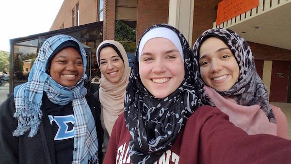 T’Asia Rankin, Malak Khader, Caralee Casto and Suzann Al-Qawasmi showcase hijabs on the Memorial Student Center plaza during Behind the Veil in an effort to embrace multicultural awareness at Marshall University Monday.
