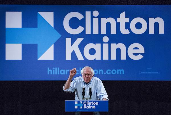 Bernie Sanders addresses a Clinton-Kaine rally inside the Prochnow Auditorium at Northern Arizona University, Tuesday, Oct. 18, 2016.  Many political observers believe that traditionally Republican Arizona is in play for this election. (Tom Tingle/The Arizona Republic via AP)