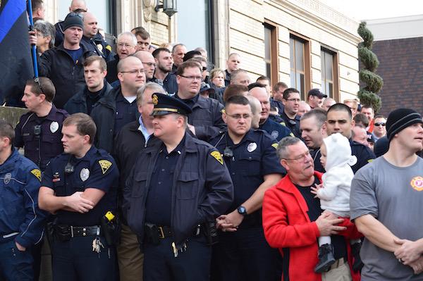 Huntington Police and Fire Department, address the public about possible layoffs. 