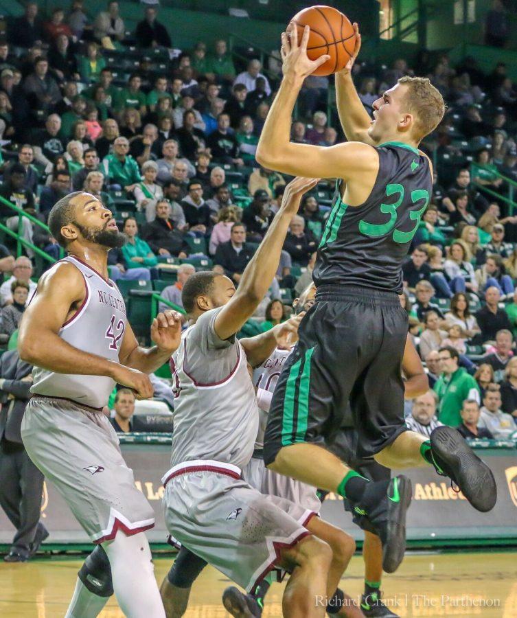 Marshall guard Jon Elmore (33) drives to the basket against North Carolina Central on November 12. Elmore is one of nine players from the state of West Virginia on the team.