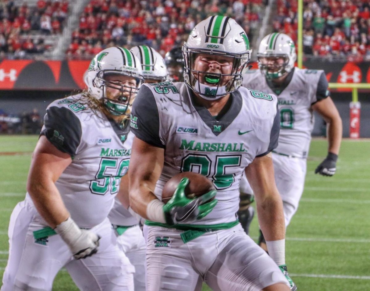 Thundering Herd tight end Ryan Yurachek celebrates in the endzone after scoring one of his two first half touchdowns against the Cincinnati Bearcats Saturday, Sept. 30 at Nippert Stadium. Yurachek finished the game with three touchdowns on six catches and 77 yards. His three receiving touchdowns marked the first time a Herd player had done so since Gator Hoskins accomplished the feat at FIU on Nov. 23, 2013.