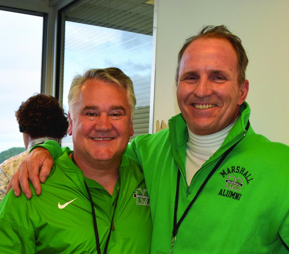 Brian Swisher (left) and Don Johnson pose for a photo during Marshall football’s season opening win against the Miami (Ohio) RedHawks at 
Joan C. Edwards Stadium Saturday, Sept. 2.