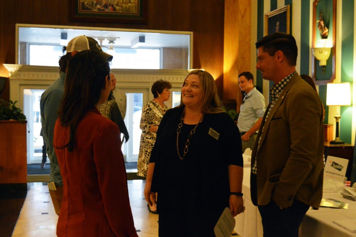 Concilwoman Jennifer Wheeler of District 4 and Councilman Alex Vence of District 3 welcome new residents to the City of Huntington during the “About Town” event at The Fredrick.