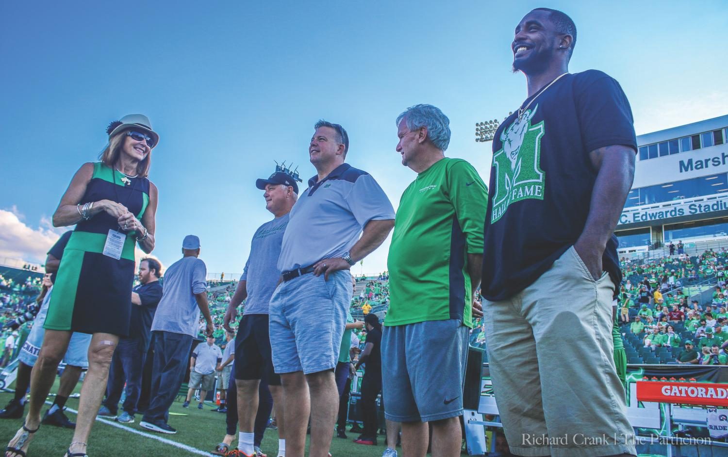 Members of Marshall Athletics’ 2017 Hall of Fame class wait to be recognized prior to kickoff of the Thundering Herd’s second home game of the year against Kent State. This year’s class included Ahmad Bradshaw, Bob Gray, Eric Ihnat, Bill James, Katie Stein Mason, 
Amanda Williams Paz, Keith Veney, David Wade and Rusty Wamsley.