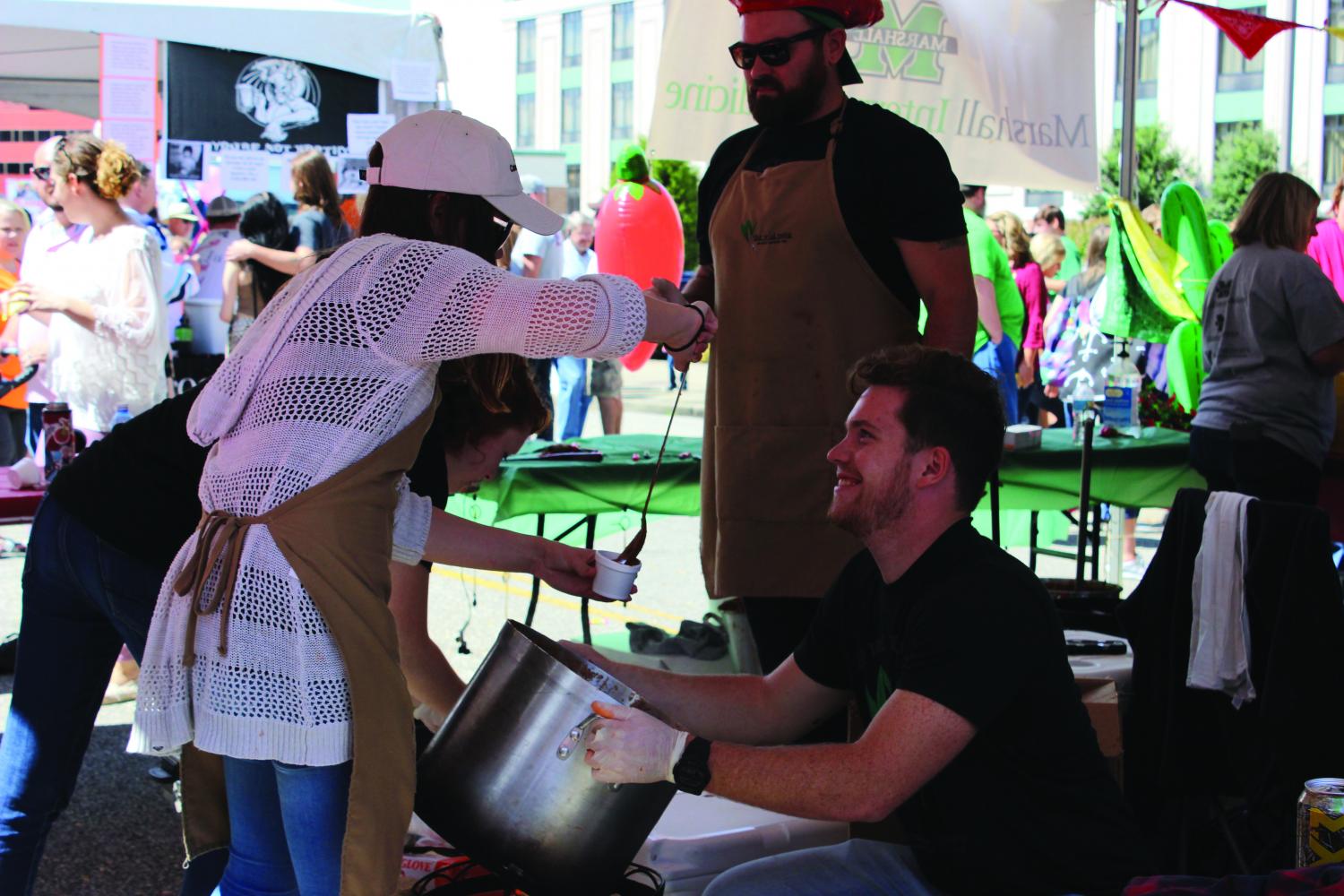 Volunteers Lydia Waybright and Ben ODell served chili for the west ends The Wild Ramp.