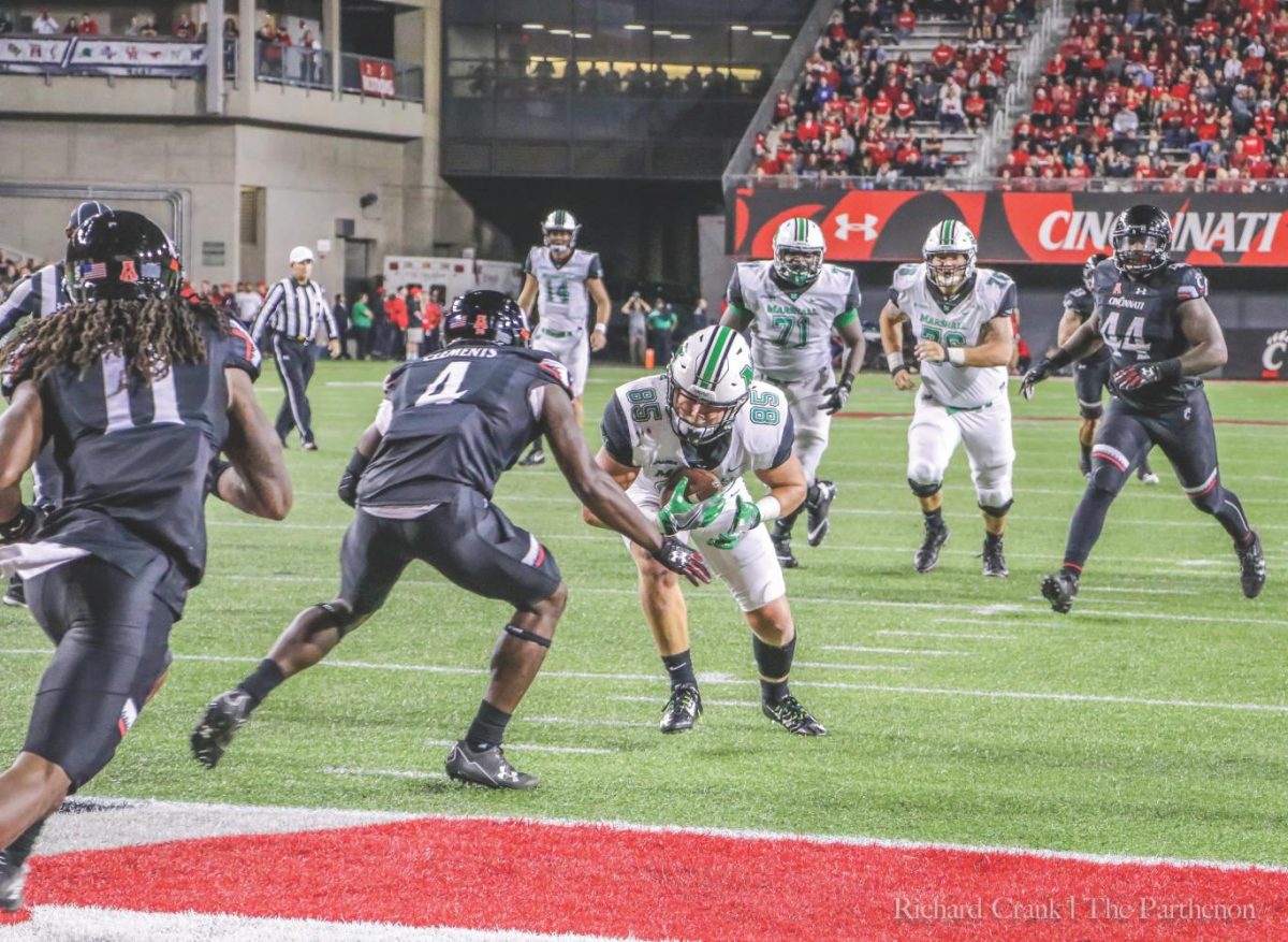 Senior tight end Ryan Yurachek (85) lowers his shoulder on his way to score a touchdown against the Cincinnati Bearcats in Nippert Stadium Saturday. Yurachek finished with three touchdowns on six receptions and 77 yards.