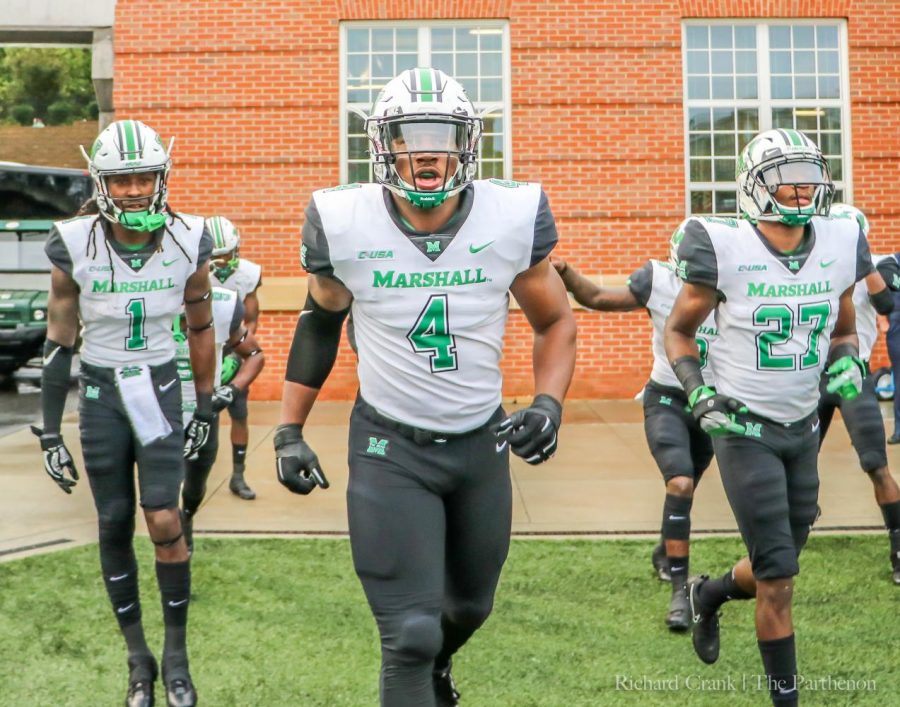 Junior linebacker Juwon Young enters the field at Jerry Richardson Stadium in Charlotte, North Carolina for his first game in a Thundering Herd uniform after serving a suspension for the first four games of the year.