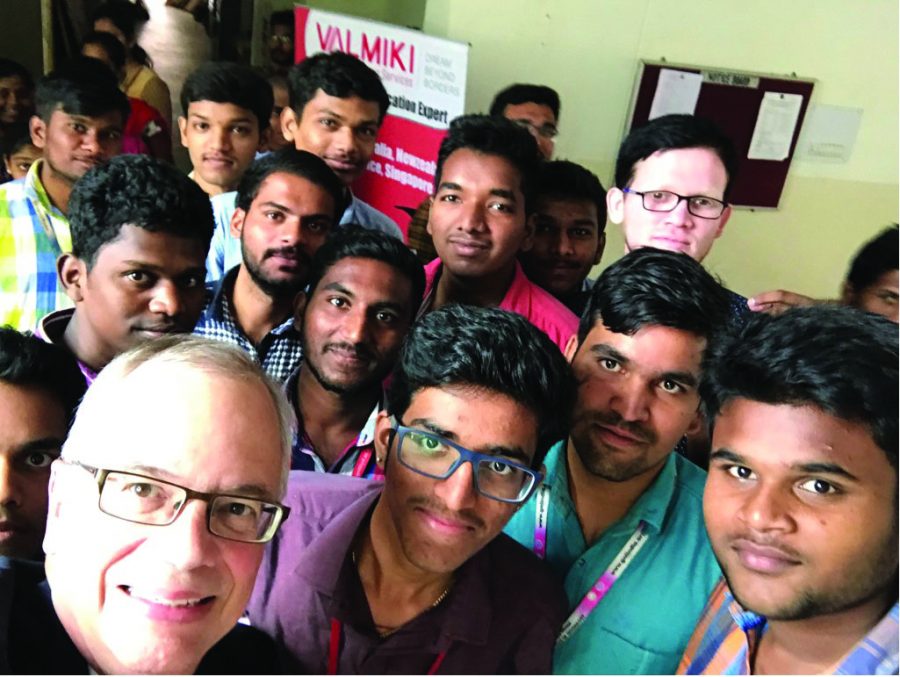 Gilbert takes a selfie with members of an all-male Indian university. 