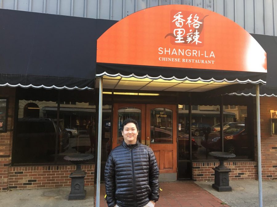 Marshall student Yangbo Song stands in front of his restaurant, Shangri-La, which opens to the public Tuesday.