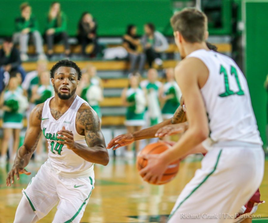 Junior guard C.J Burks prepares to reviece a pass from junior forward Ajdin Penava. Burks continues his five-game streak of leading the Herd in total points scored, as he comes off a 29-point scoring performance against 
Western Kentucky. 