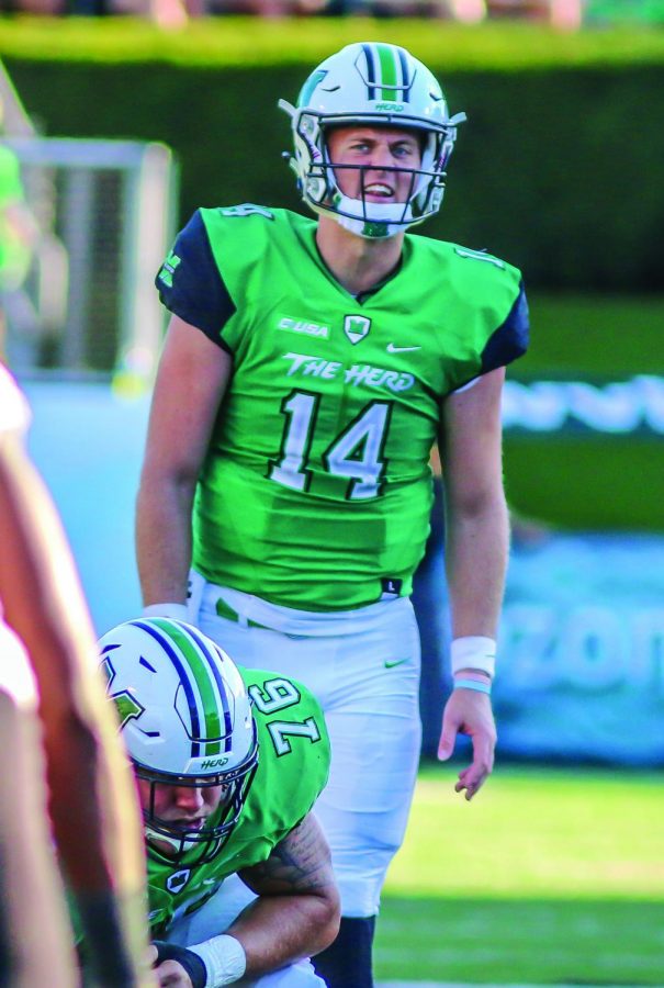 Quarterback Chase Litton (14) calls out a play during the Herd’s game against ODU October 14, 2017. Litton, who declared for the NFL Draft, took part in the NFL Scouting Combine last week and Marshall’s pro day Wednesday.