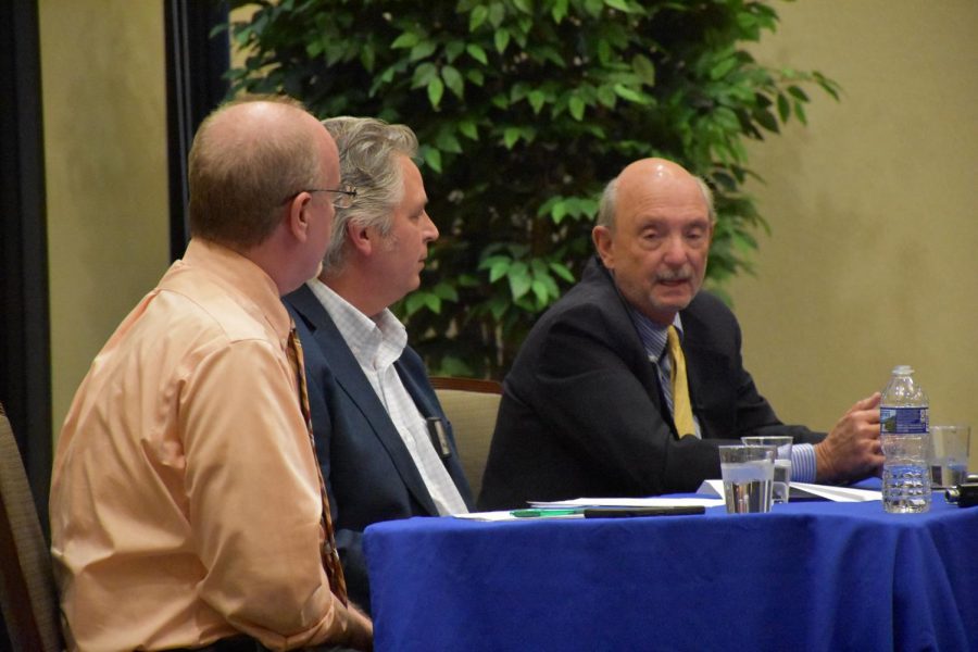 Marshall Journalism Professor Dan Hollis (Left) Eric Eyre (Middle) and John Hackworth (Right),  Eyre and Hackworth Pulitzer Prize winners, spoke to Huntington community members about being an informed citizen and the path to the Pulitzer Prize Monday, at the Brad D. Smith Foundation Hall.