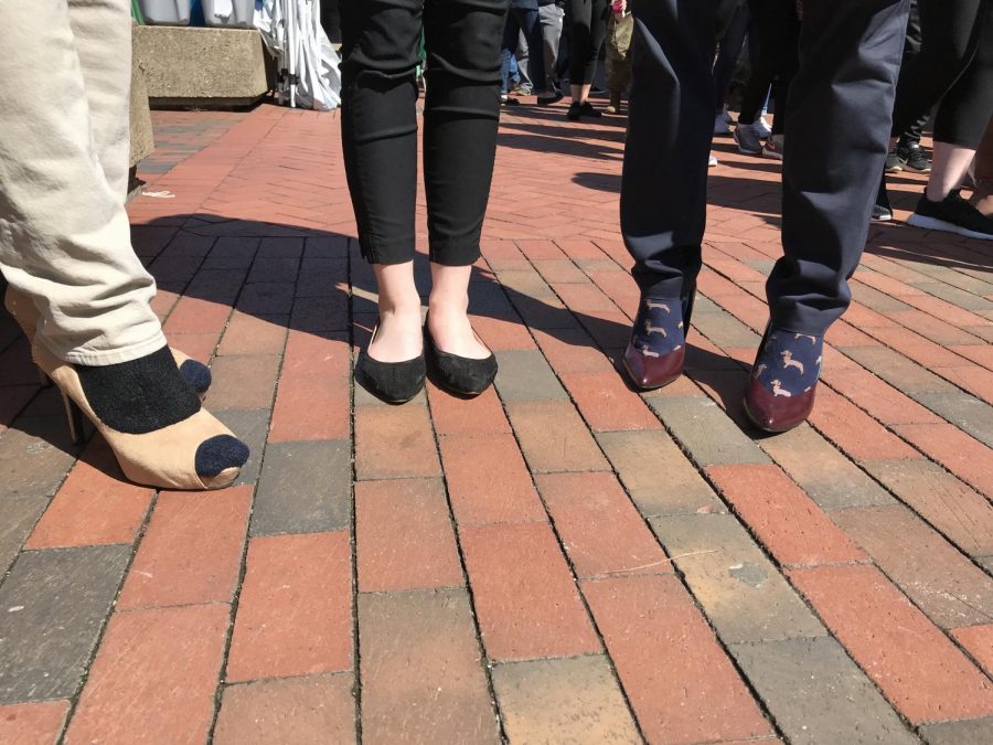 SGA President Matt Jarvis (Left), SGA Vice President-Elect Hannah Petracca (Middle) and Assistant Dean of Student Affairs Matt James show off their footwear for Walk a Mile in Her Shoes Thursday. 
