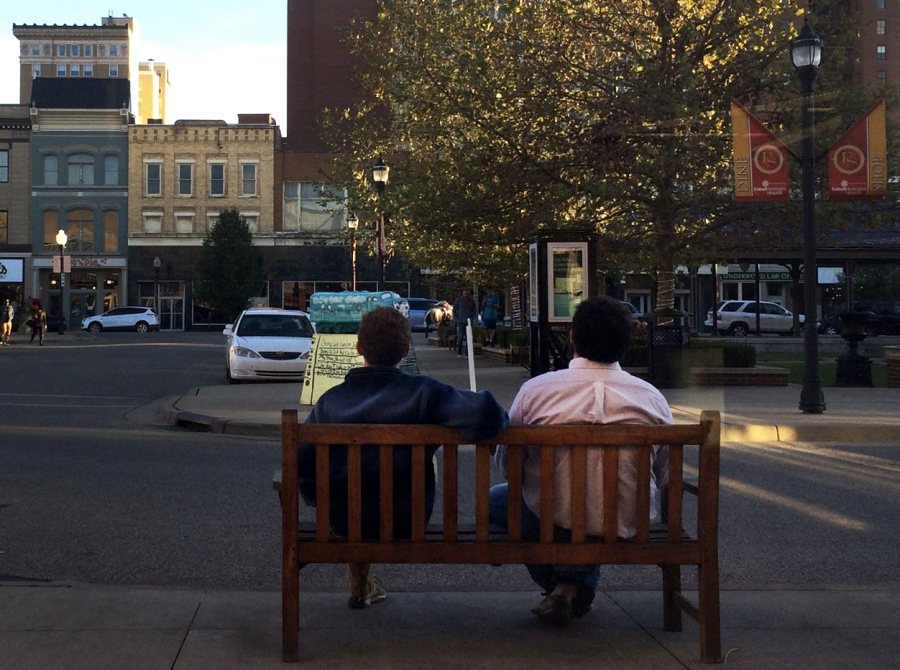 Franklin sits and relaxes in downtown Huntington with his friend and roommate Josh Hastings.