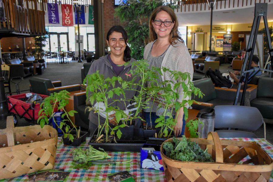 Angela Kargul and Amy Parsons-White at the Memorial Student Center holding their weekly farmer’s market.