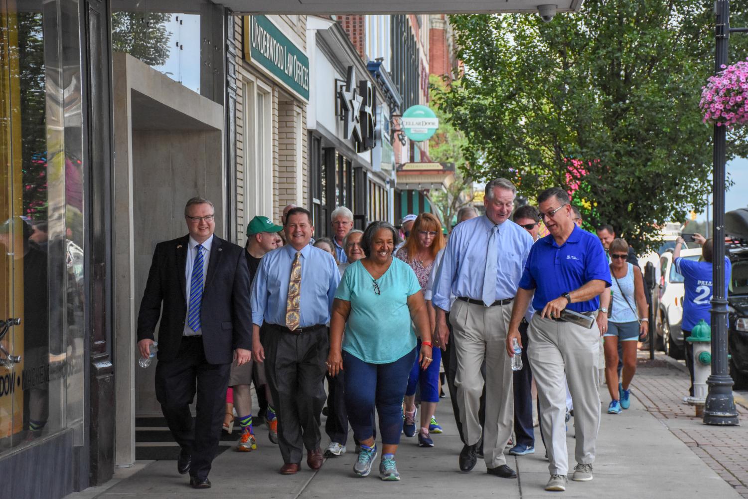 City leaders on July 17, 2018, guiding the community with their first steps on the journey of walking to the moon.