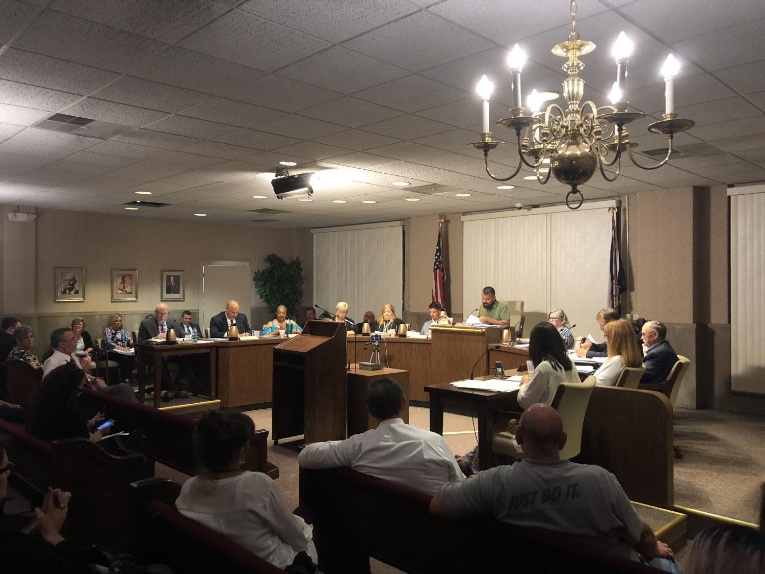 City Council members discuss signing ordinance that would require landlords to register for mandatory maintenance on Monday evening.