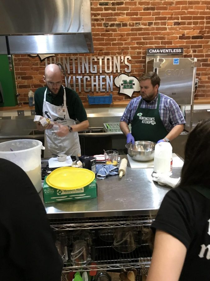 Chef manager Marty Emerson (right) teaches cooking class to community members at Huntington’s Kitchen.