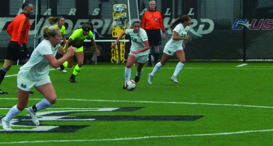 Junior midfielder Gabby Powers advances the ball across the midfield against North Texas. Powers has started all 15 matches for the Herd this season.