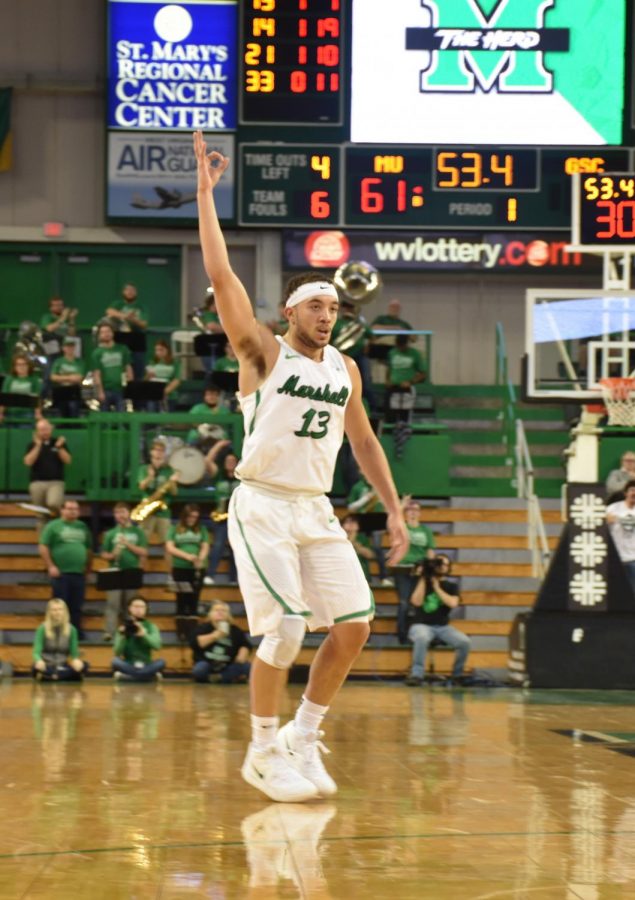 Sophomore guard Jarrod West holds up a hand gesture after hitting a 3-pointer in Marshall’s 113-108 win over Glenville State. The Herd plays another exhibition Thursday before beginning the regular season Nov. 7 at Eastern Kentucky.