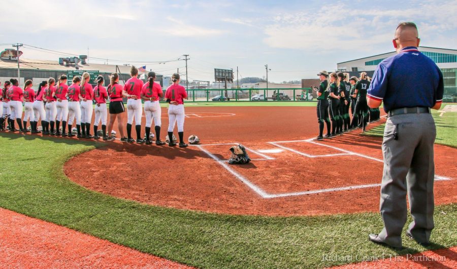 Marshall's softball team lines up for the national anthem prior to its home game against Charlotte last season. 