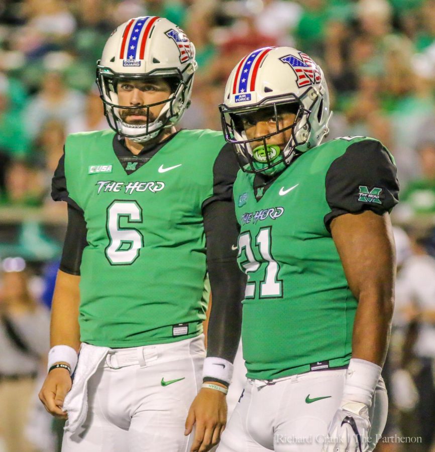 Quarterback Alex Thomson and running back Anthony Anderson look towards the sideline for a play call during Marshalls 34-24 loss to Middle Tennessee.