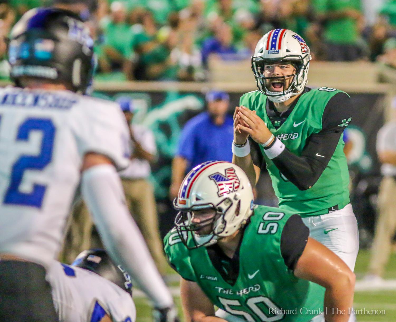 Marshall redshirt junior quarterback Alex Thomson prepares to take a snap under-center against MTSU in Saturday’s home loss--his first game for the Herd.