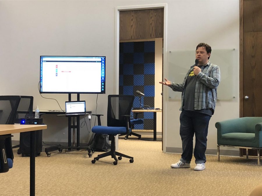 Justin McElroy, Huntington native and Marshall University graduate, teaches fellow Huntingtonians the art of podcasting in the recording studio at CoWorks.