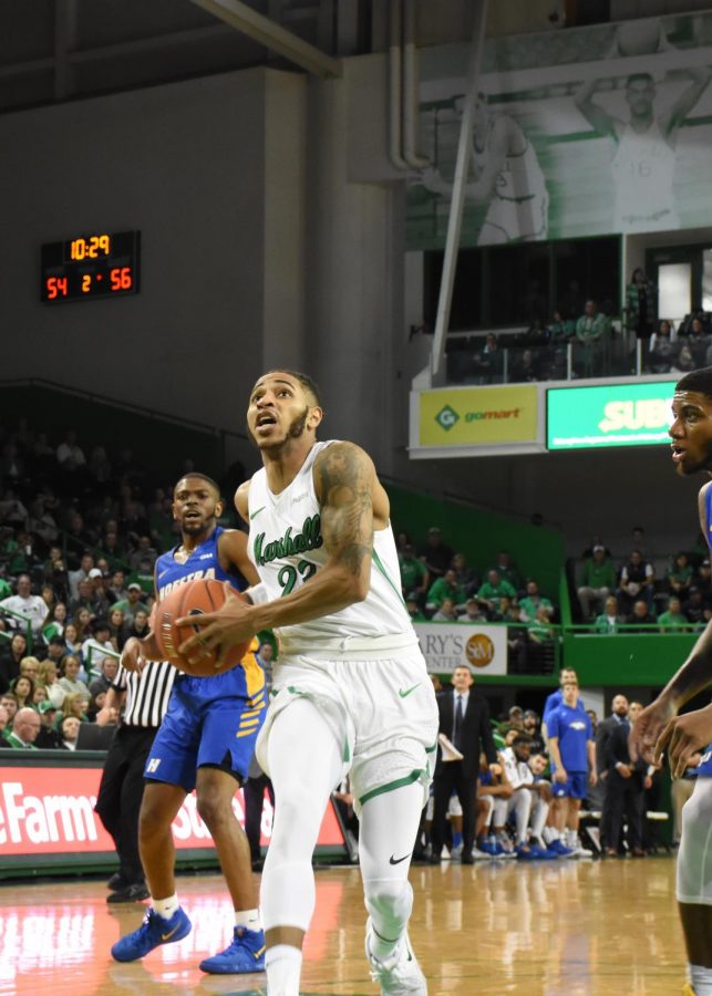 Marshall senior guard Rondale Watson drives through Hofstra defenders in the paint. Watson has 14 points in Marshalls win over the Pride.
