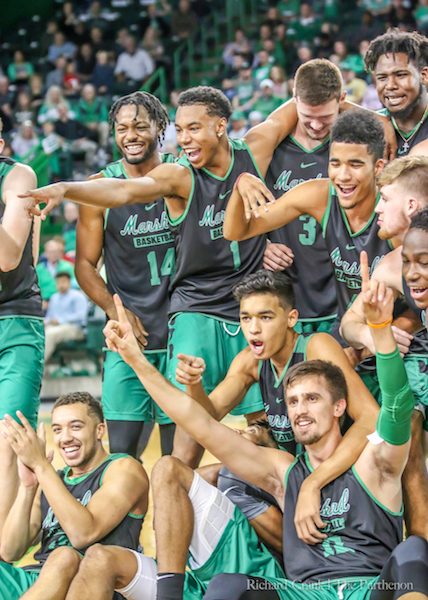 Herd mens basketball players pose for a group photo at Herd Madness.