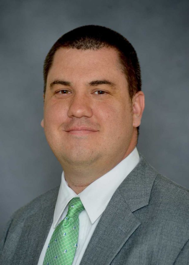 Jason Corriher is the assistant athletics director for media relations at Marshall University and oversees the sports information program.