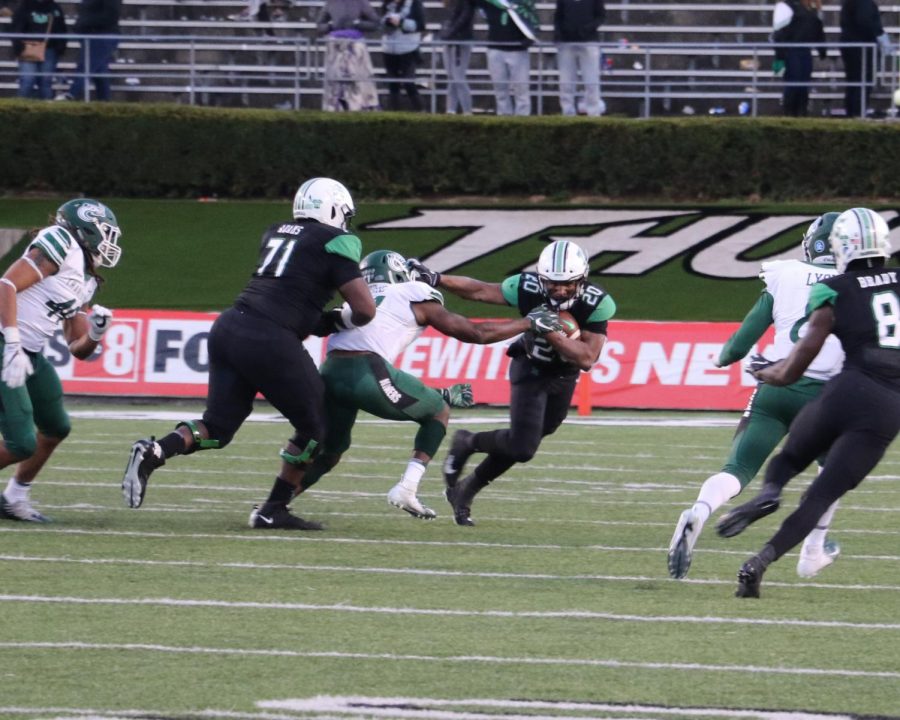 Brenden Knox avoids a Charlotte defender to break into open space. Knox gains 116 yards on 22 carries in the contest.