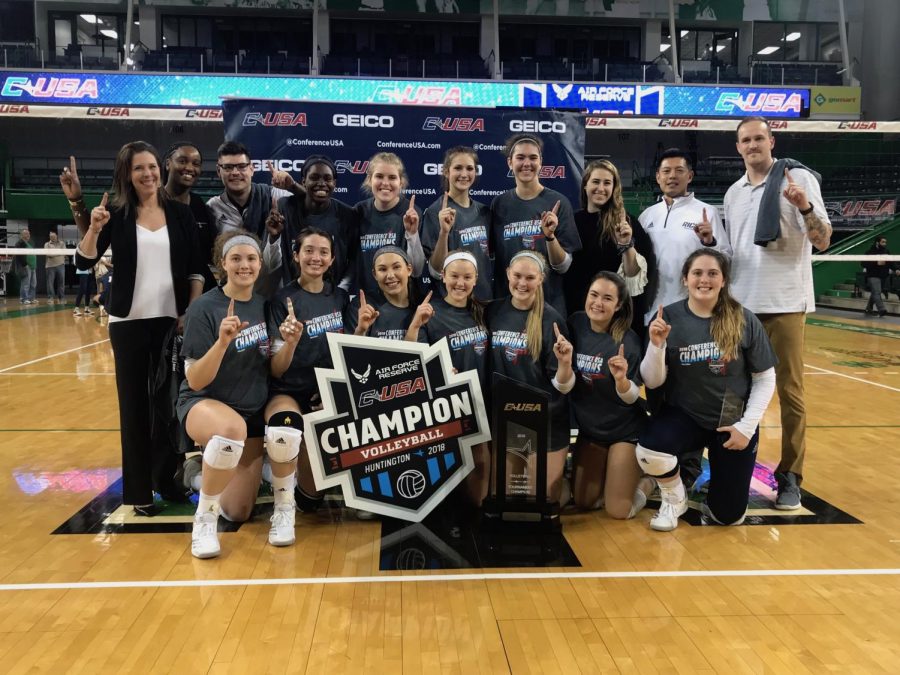 The Rice volleyball team poses with the Conference-USA Championship trophy after defeating FIU 3-1.