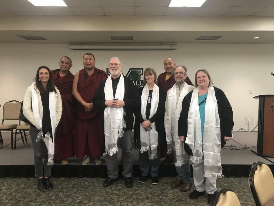 Monks from the Tashi Kyil Monastery in Dehradun, India, pose for a photo with Marshall University faculty.