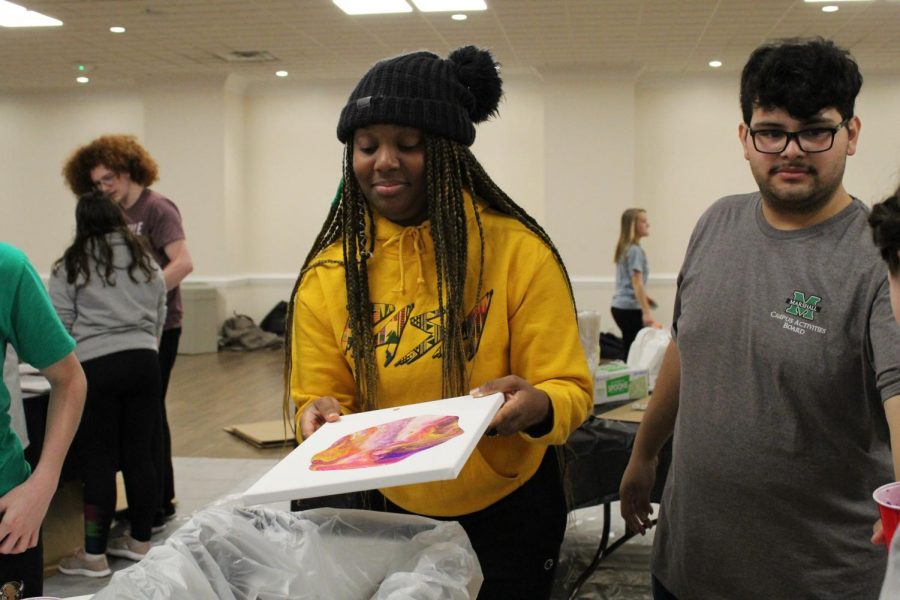 Marshall students participate in the DIY dirty pour painting event at the Memorial Student Center.