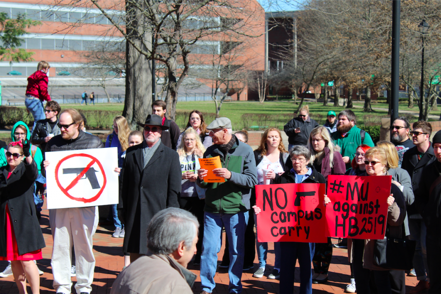 Locals+gather+to+protest+proposed+campus-carry+bill%2C+Monday+at+Marshall+Universitys+Memorial+Fountain.