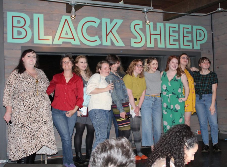 The lineup of all female comedians posing for a group photograph after the show.