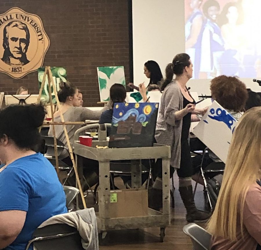 Students socialize, create artwork at Paint and Sip event