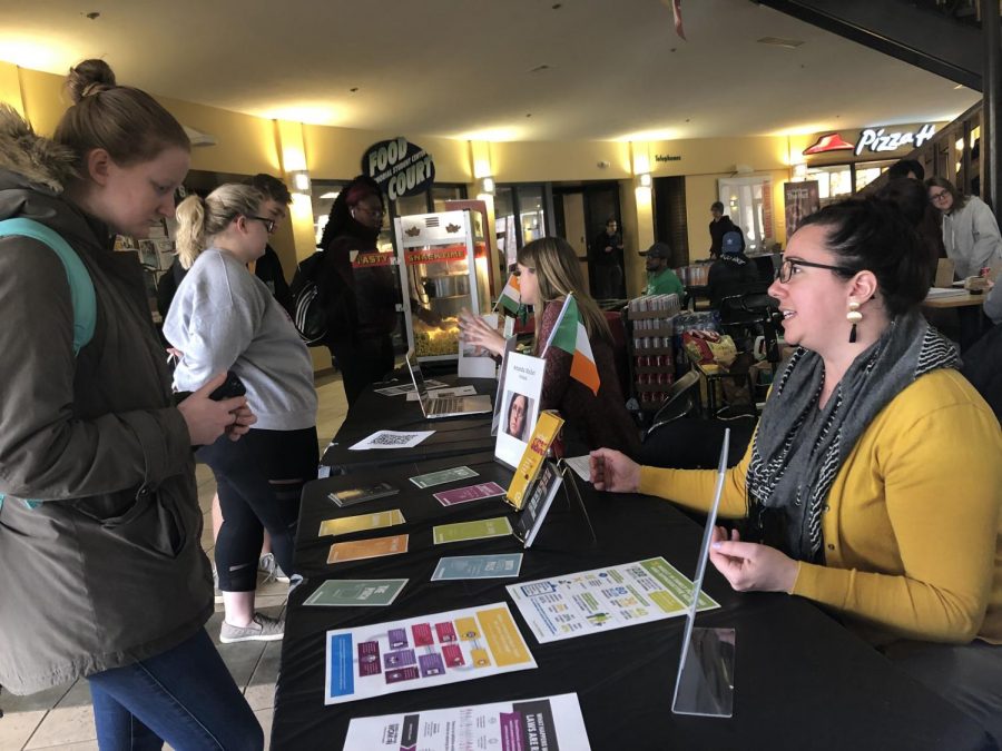 Claire Snyder, program coordinator for Marshalls Women and Gender Center, provides information to interested students in the Student Center.