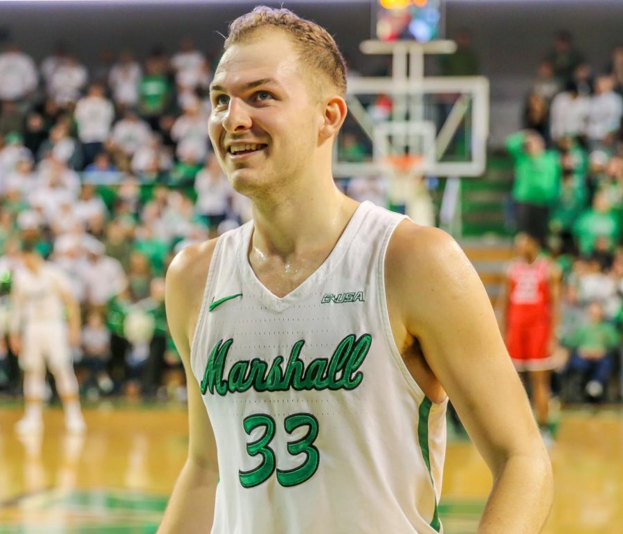 Marshall guard Jon Elmore (33) smiles in the closing moments of Marshalls game against Western Kentucky at the Cam Henderson Center on Jan. 12, 2019. 
