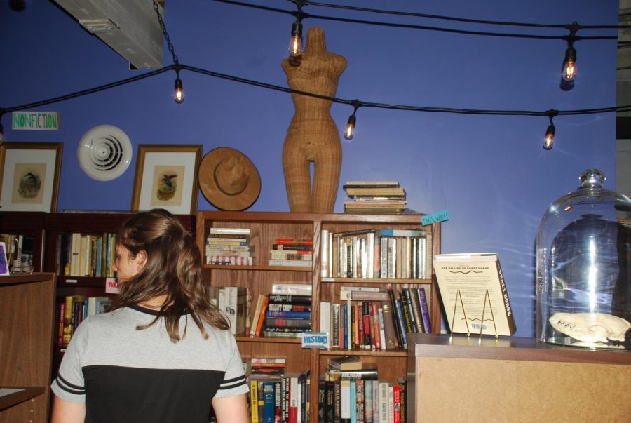 Amber Sturgill searched for her next potential read at Cicada Books and Coffee which opened in July 2018.