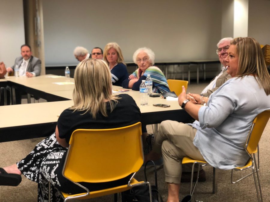 Amber McCoy, president of the Wayne County Education Association and teacher at Kellogg Elementary School, addresses legislators at an education town hall Monday at the Cabell County Public Library in Huntington.