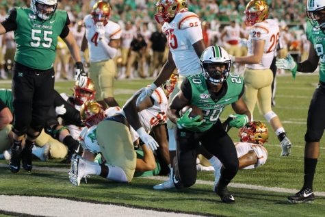 Brendon Knox carries the ball for the Herd.
