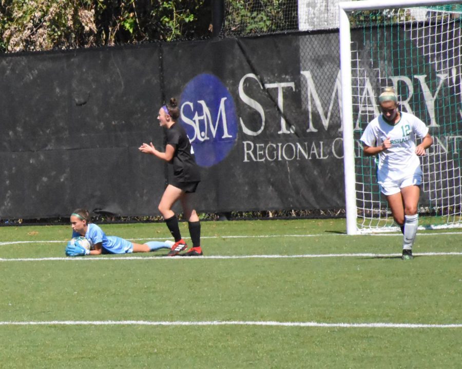 Lindsay Langley saves a goal during the Marshall vs High Point game.